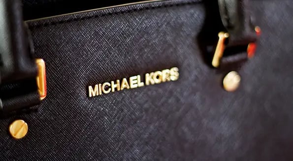 Michael kors hotsell buys louis vuitton